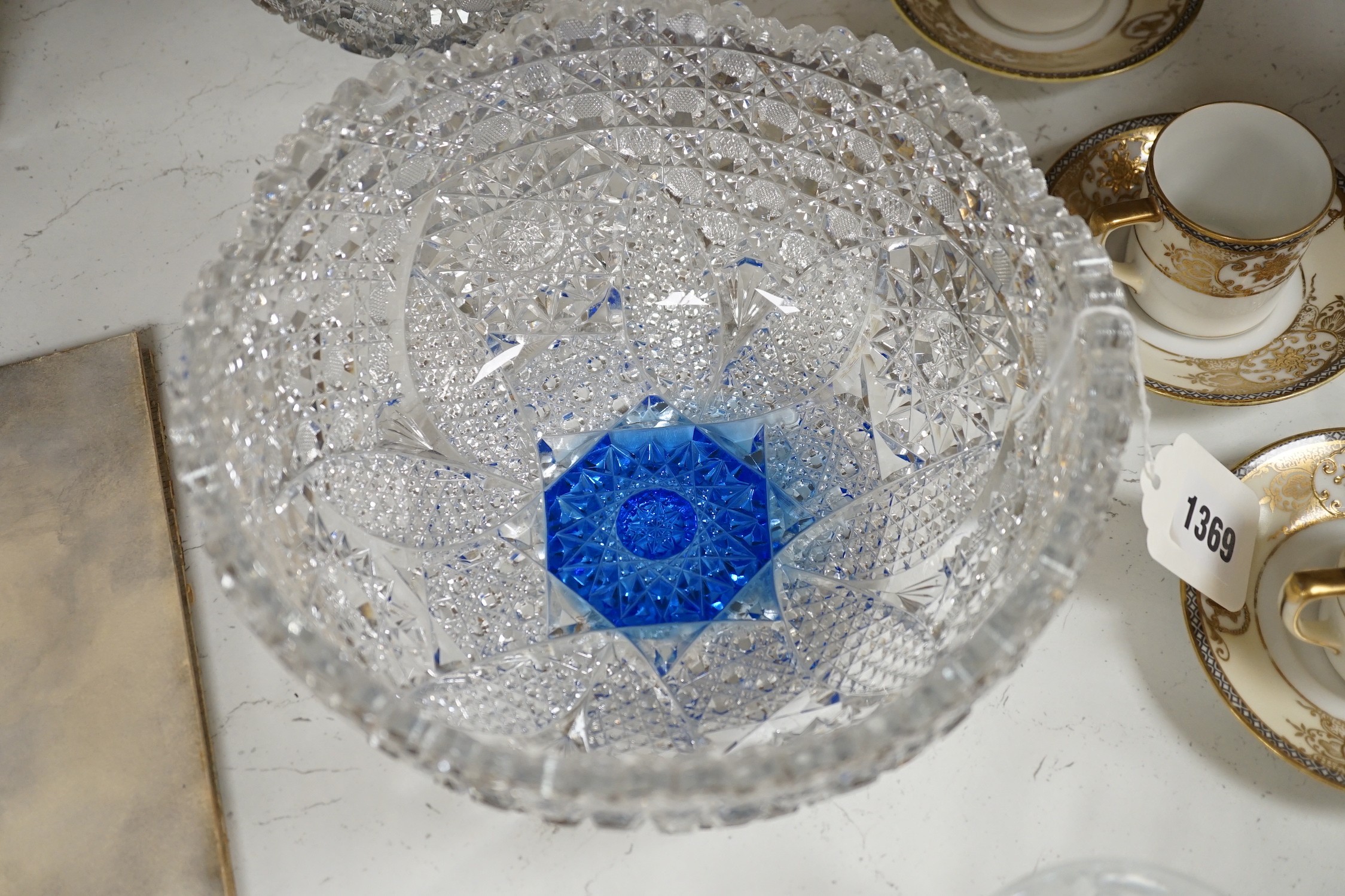 A Pair of Bohemian or Czech heavy cuts glass fruit bowls with blue flashed centres, 22.5 cm diameter, two decanters and six tumblers.